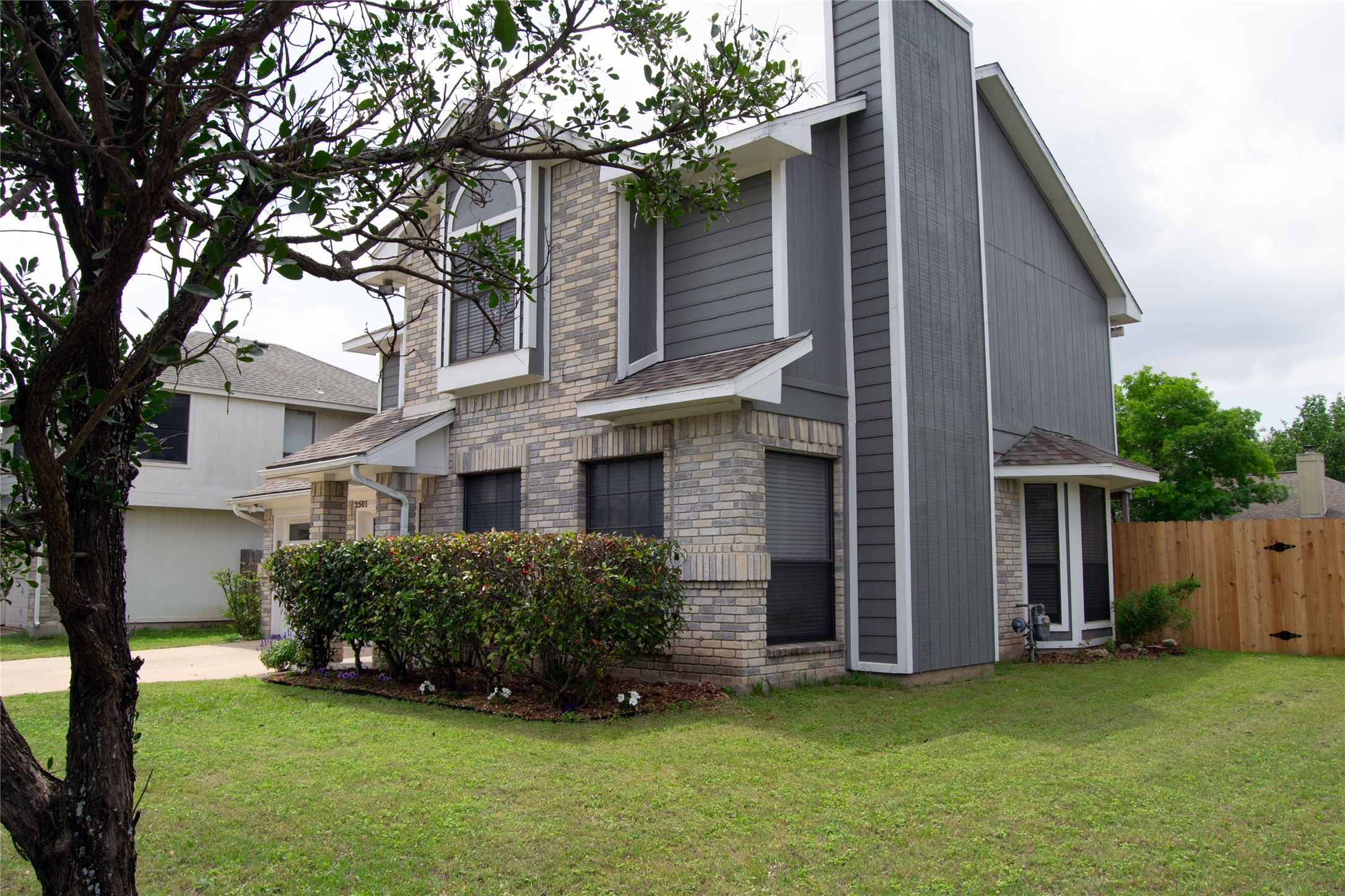 2501 Autrey Drive Leander, TX 78641 - Photo 2 of 27 a front view of a house with a garden