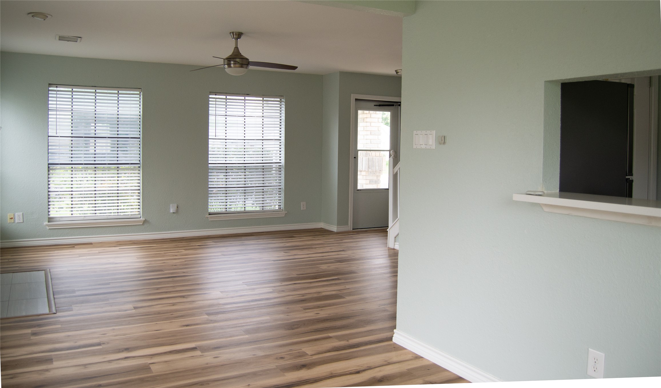 2501 Autrey Drive Leander, TX 78641 - Photo 4 of 27 an empty room with wooden floor and windows