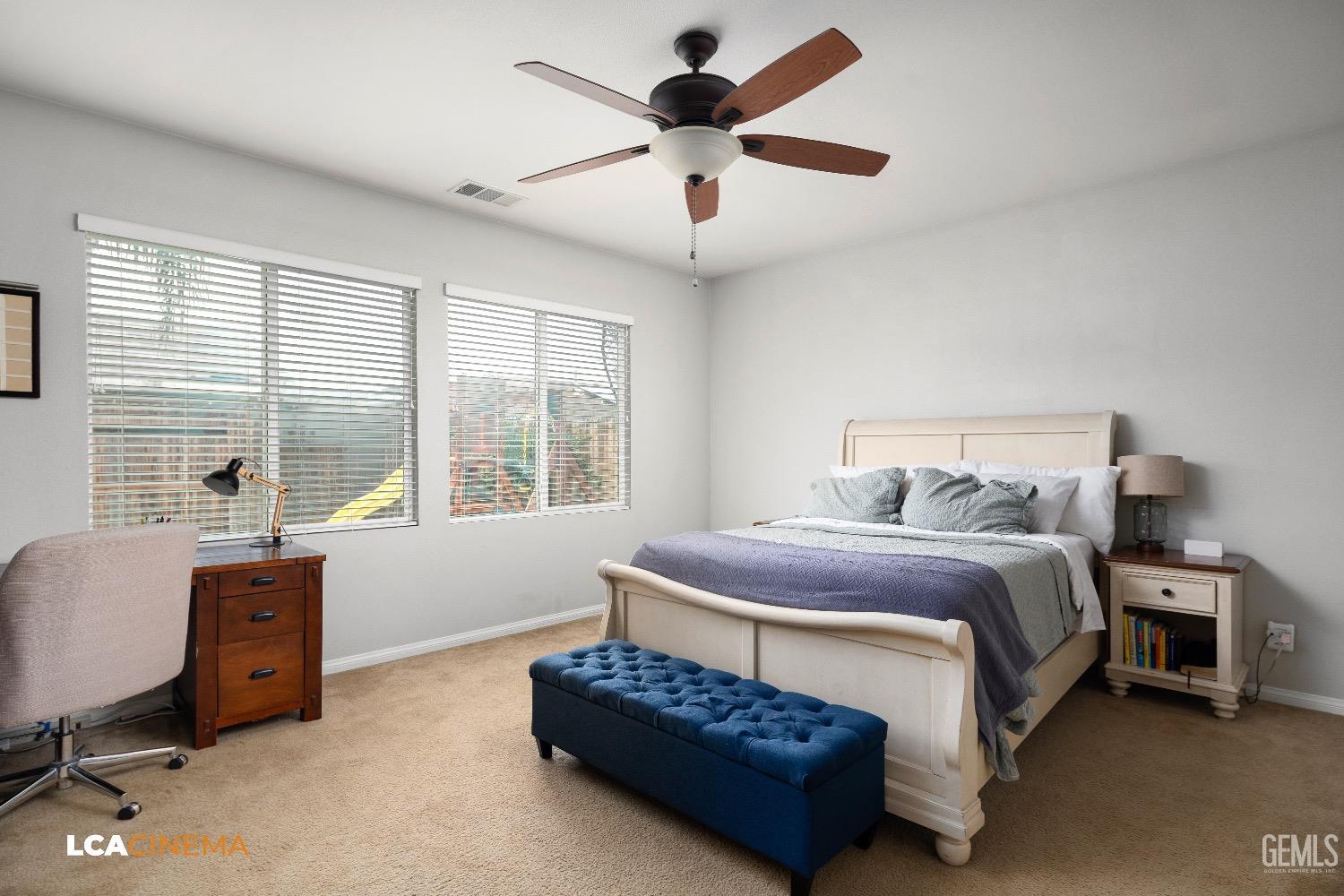 Undisclosed Address Bakersfield, CA 93313 - Photo 15 of 28 a bedroom with a bed and a large window