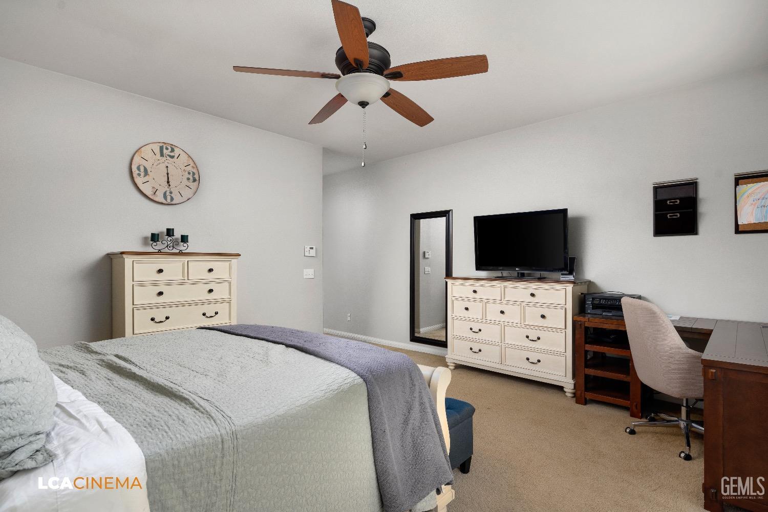 Undisclosed Address Bakersfield, CA 93313 - Photo 16 of 28 a bedroom with a bed and flat screen tv