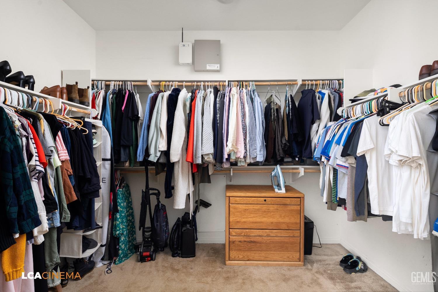 Undisclosed Address Bakersfield, CA 93313 - Photo 20 of 28 a view of walk in closet with clothes and shoes