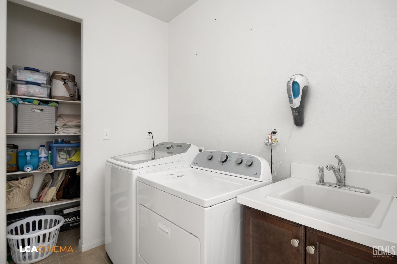 Undisclosed Address Bakersfield, CA 93313 - Photo 21 of 28 a bathroom with a sink and a vanity