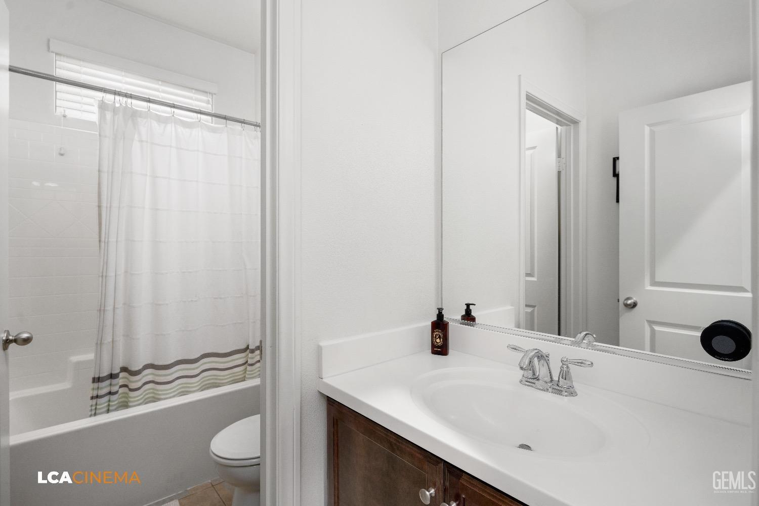 Undisclosed Address Bakersfield, CA 93313 - Photo 22 of 28 a bathroom with a sink a toilet and shower