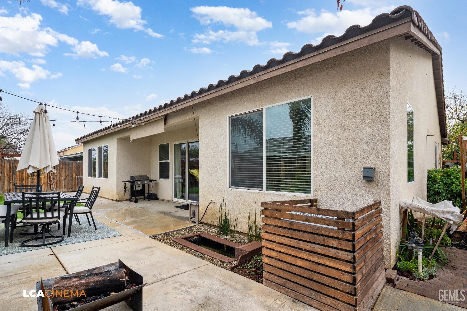 Undisclosed Address Bakersfield, CA 93313 - Photo 26 of 28 a front view of a house with outdoor seating