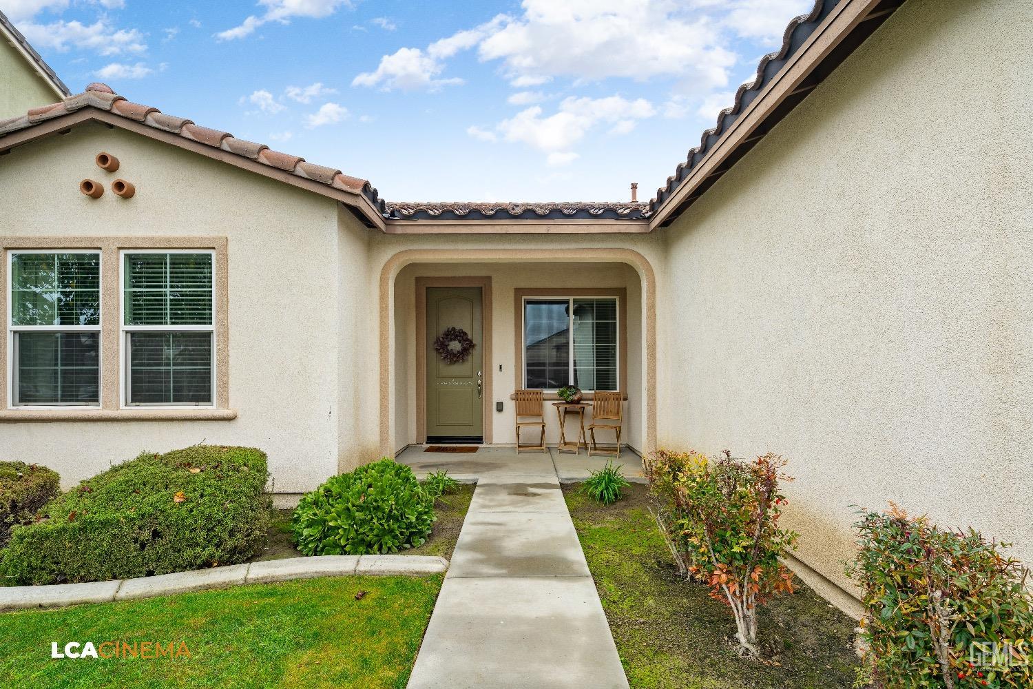 Undisclosed Address Bakersfield, CA 93313 - Photo 5 of 28 a front view of a house with garden