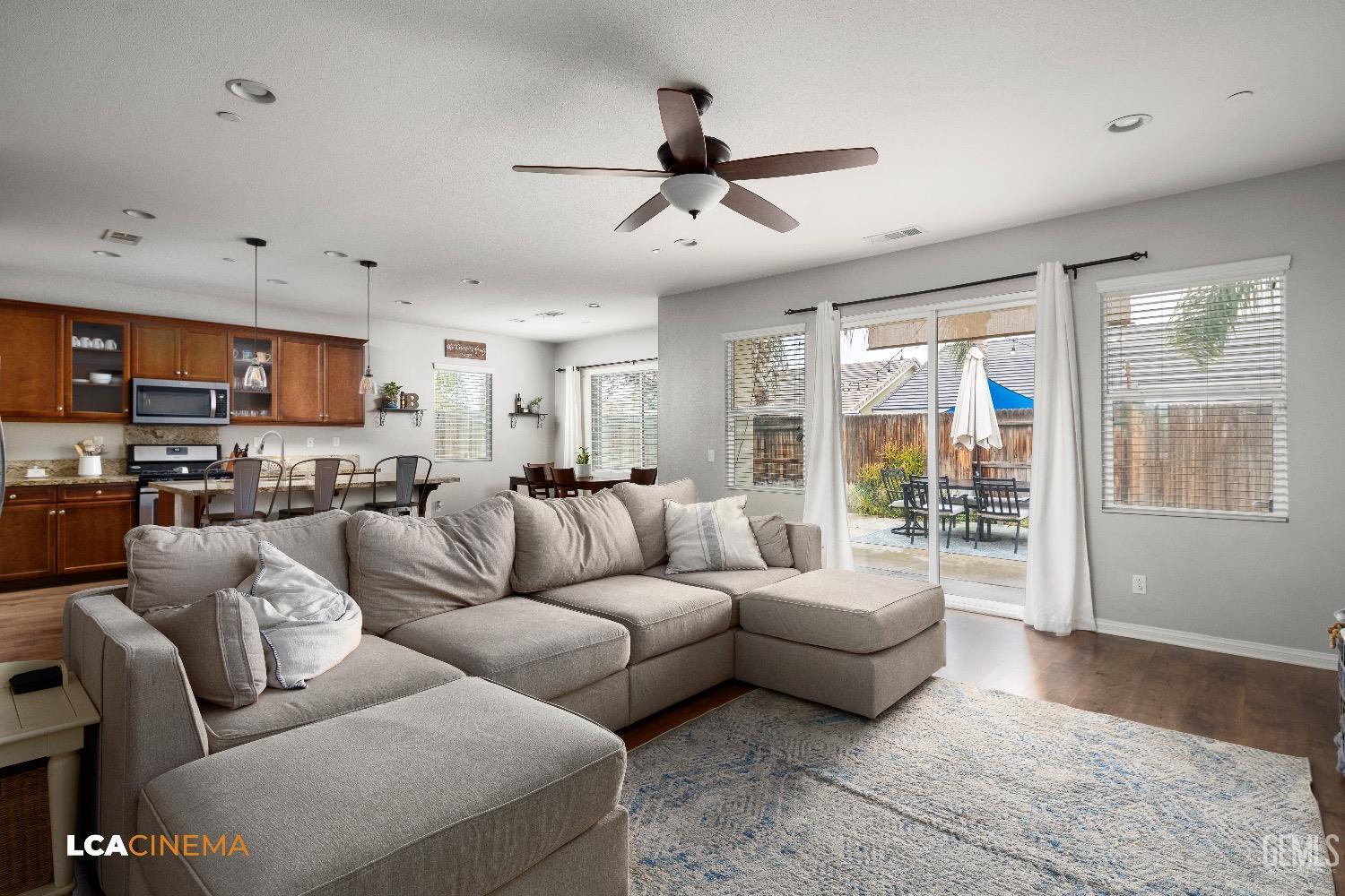 Undisclosed Address Bakersfield, CA 93313 - Photo 8 of 28 a living room with furniture and a large window