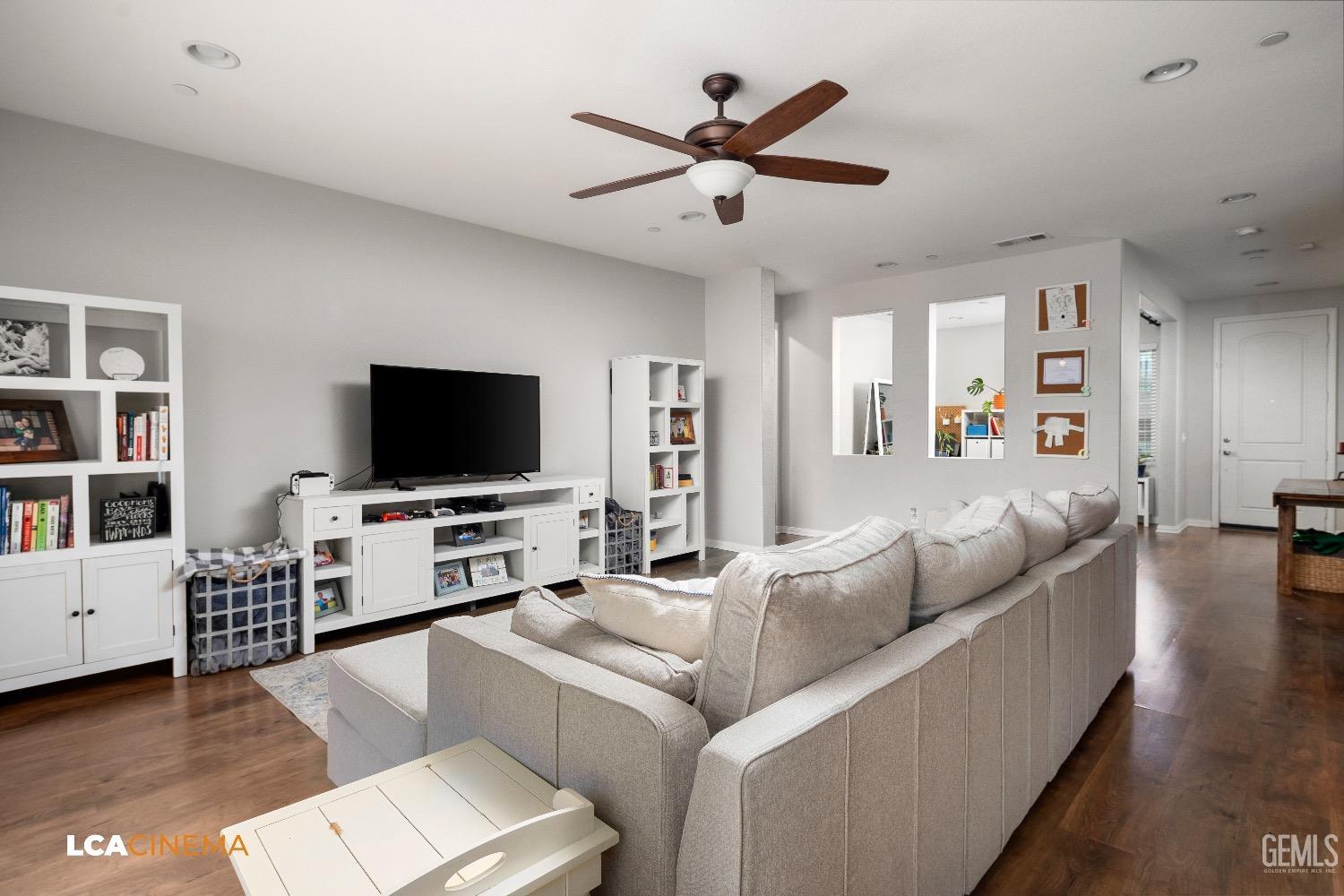 Undisclosed Address Bakersfield, CA 93313 - Photo 9 of 28 a living room with furniture and a flat screen tv