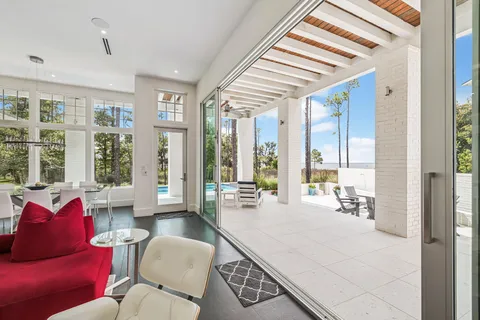 a large dining space with stainless steel appliances granite countertop a dining table and chairs