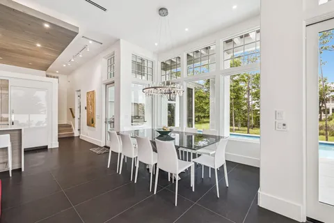 a bathroom with a sink a vanity and painting on the wall