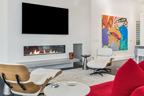 a view of a dining room with furniture and a window