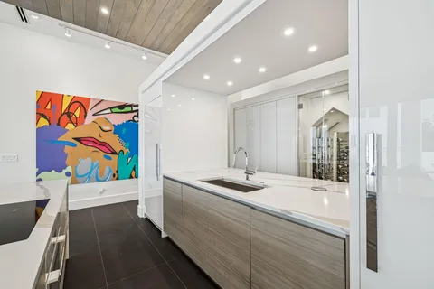 a bathroom with a large window and a bathtub in a balcony