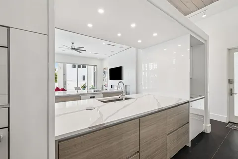 a spacious bedroom with a large bed and a flat screen tv