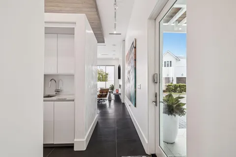 a bedroom with a balcony a bed and a window