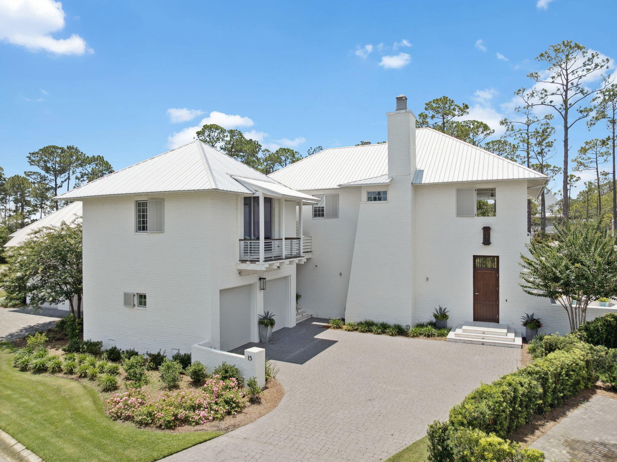 15 Parish Santa Rosa Beach, FL 32459 - Photo 4 of 122 a view of a white house with a yard and potted plants
