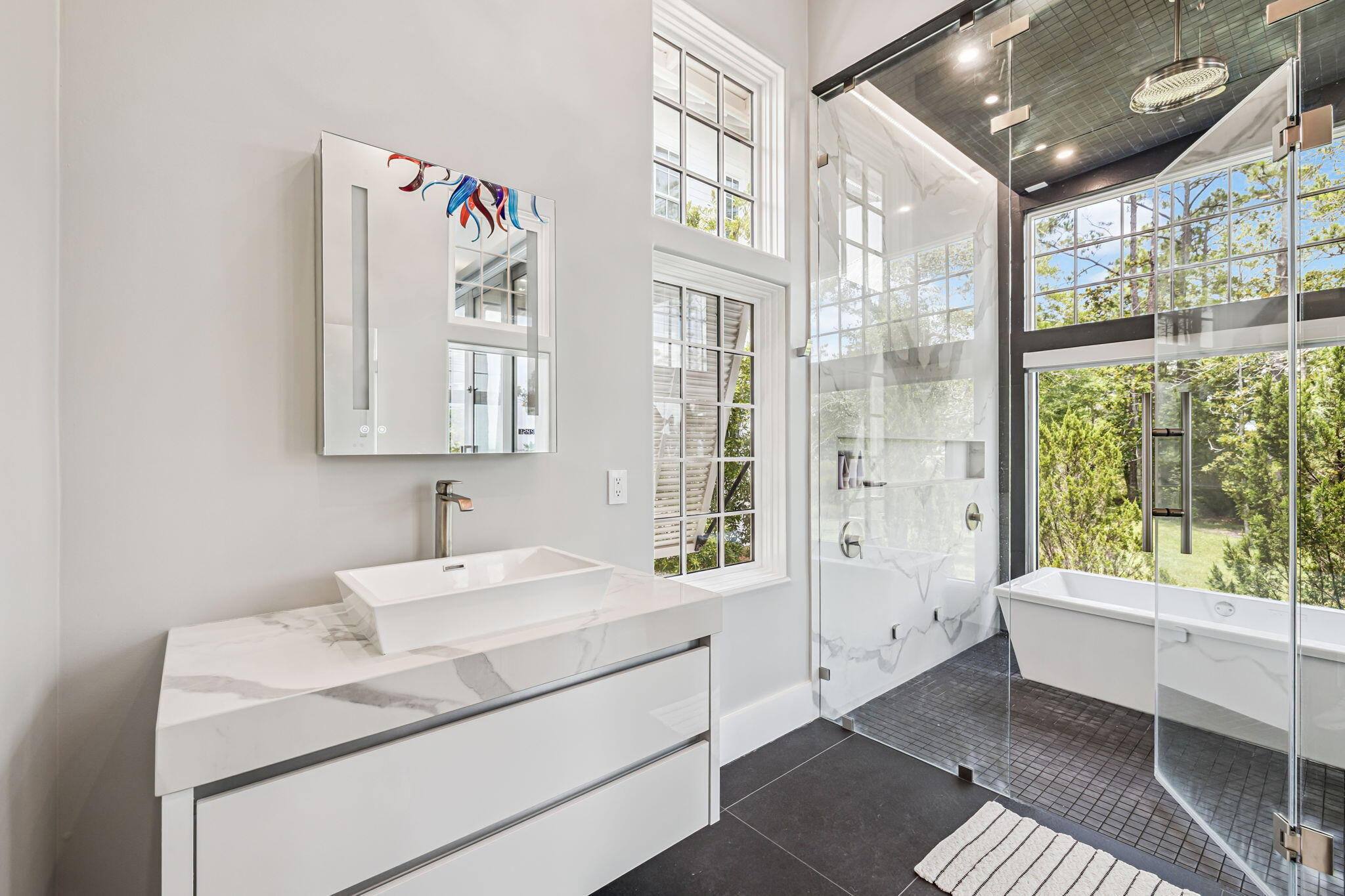 15 Parish Santa Rosa Beach, FL 32459 - Photo 41 of 122 a bathroom with a sink mirror and a bathtub next to a window