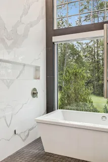 a kitchen with stainless steel appliances granite countertop a stove and a refrigerator