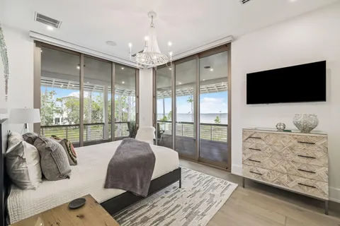 a view of a swimming pool with a patio and a yard