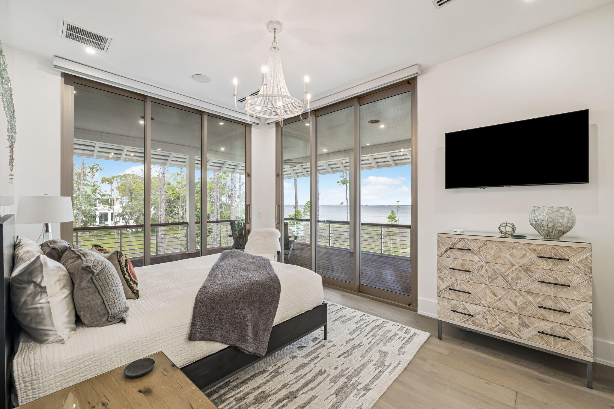 15 Parish Santa Rosa Beach, FL 32459 - Photo 50 of 122 a spacious bedroom with a large bed and a flat screen tv