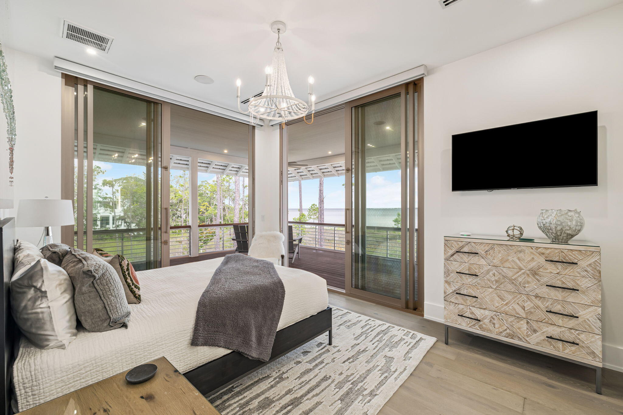 15 Parish Santa Rosa Beach, FL 32459 - Photo 51 of 122 a spacious bedroom with a large bed and a flat tv screen on dresser