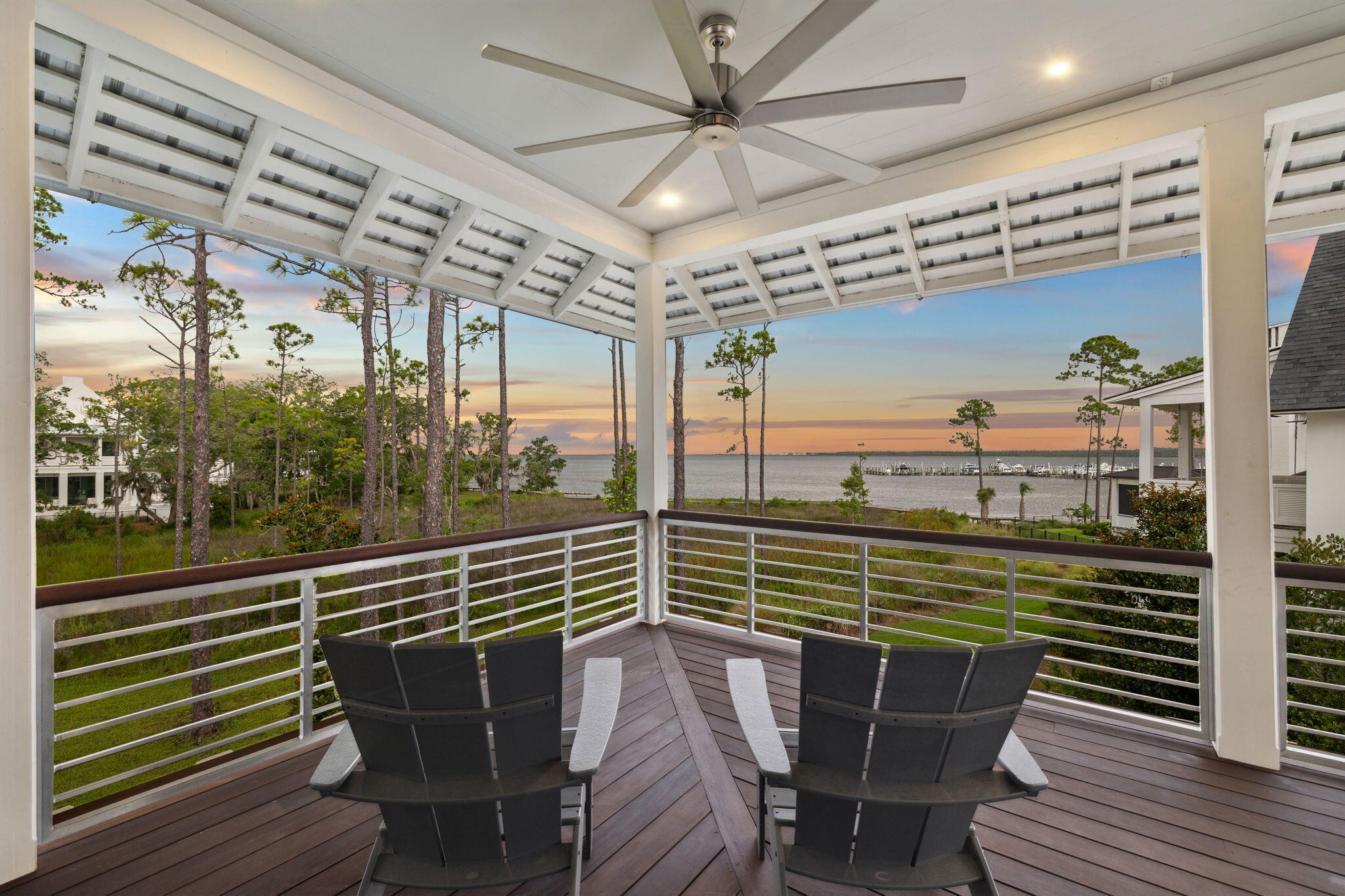 15 Parish Santa Rosa Beach, FL 32459 - Photo 83 of 122 a view of a balcony with a dining table chairs and wooden floor