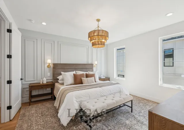 a bedroom with bed and window