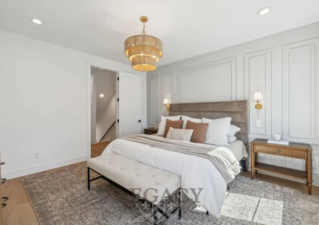 a bedroom with bed and a window