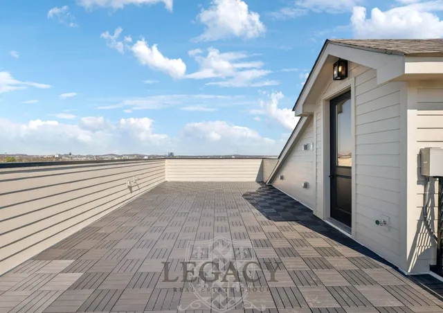 a view of a terrace view with wooden floor and a floor to ceiling window