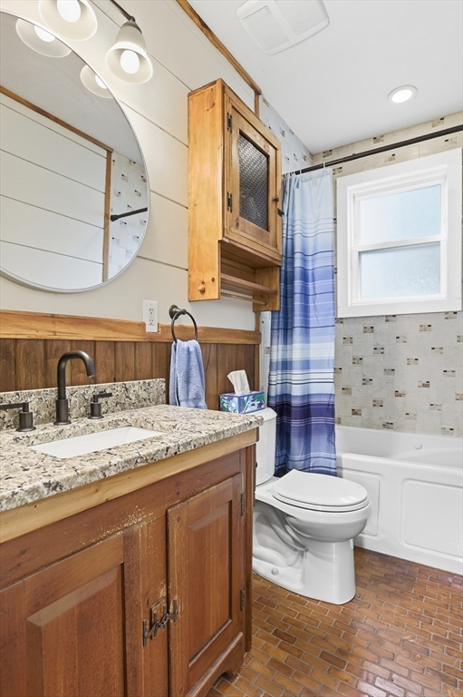 2 Cashman Road Peabody, MA 01960 - Photo 15 of 37 a bathroom with a granite countertop toilet sink and mirror