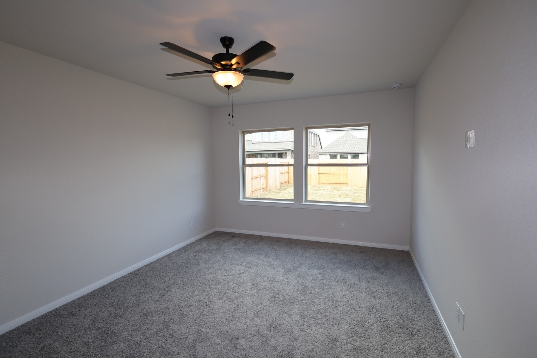 42568 Edmund Rucker Lane Magnolia, TX 77354 - Photo 10 of 18 an empty room with ceiling fan and windows