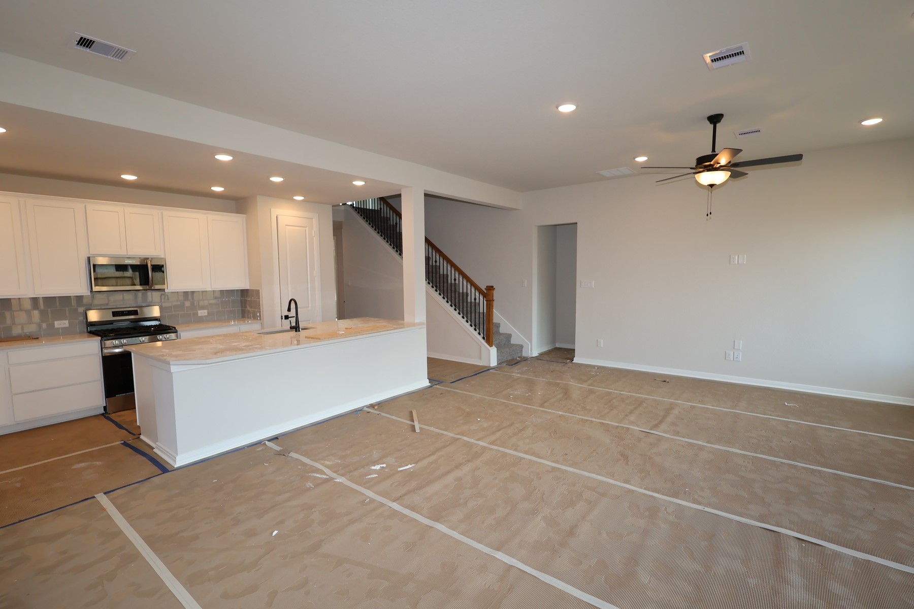 42568 Edmund Rucker Lane Magnolia, TX 77354 - Photo 13 of 18 a view of kitchen with kitchen island white cabinets and stainless steel appliances