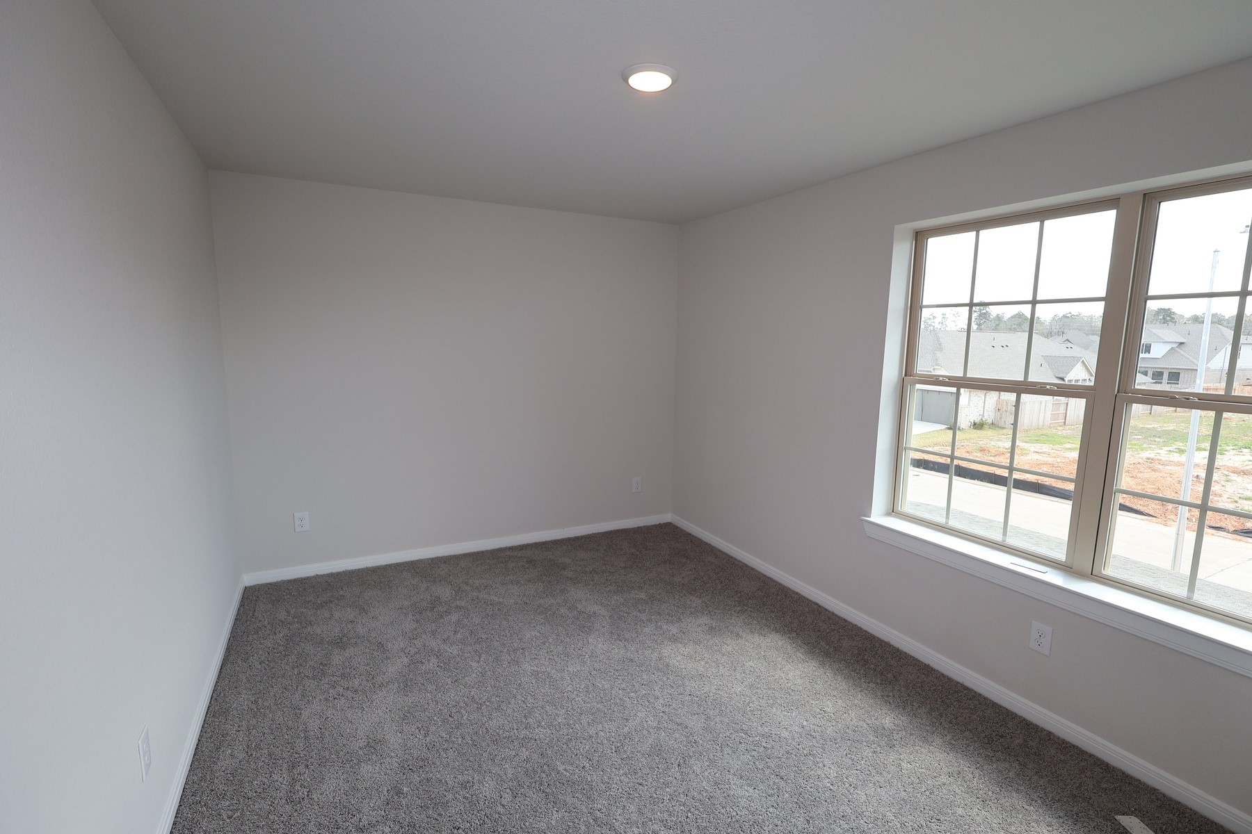 42568 Edmund Rucker Lane Magnolia, TX 77354 - Photo 5 of 18 an empty room with a window