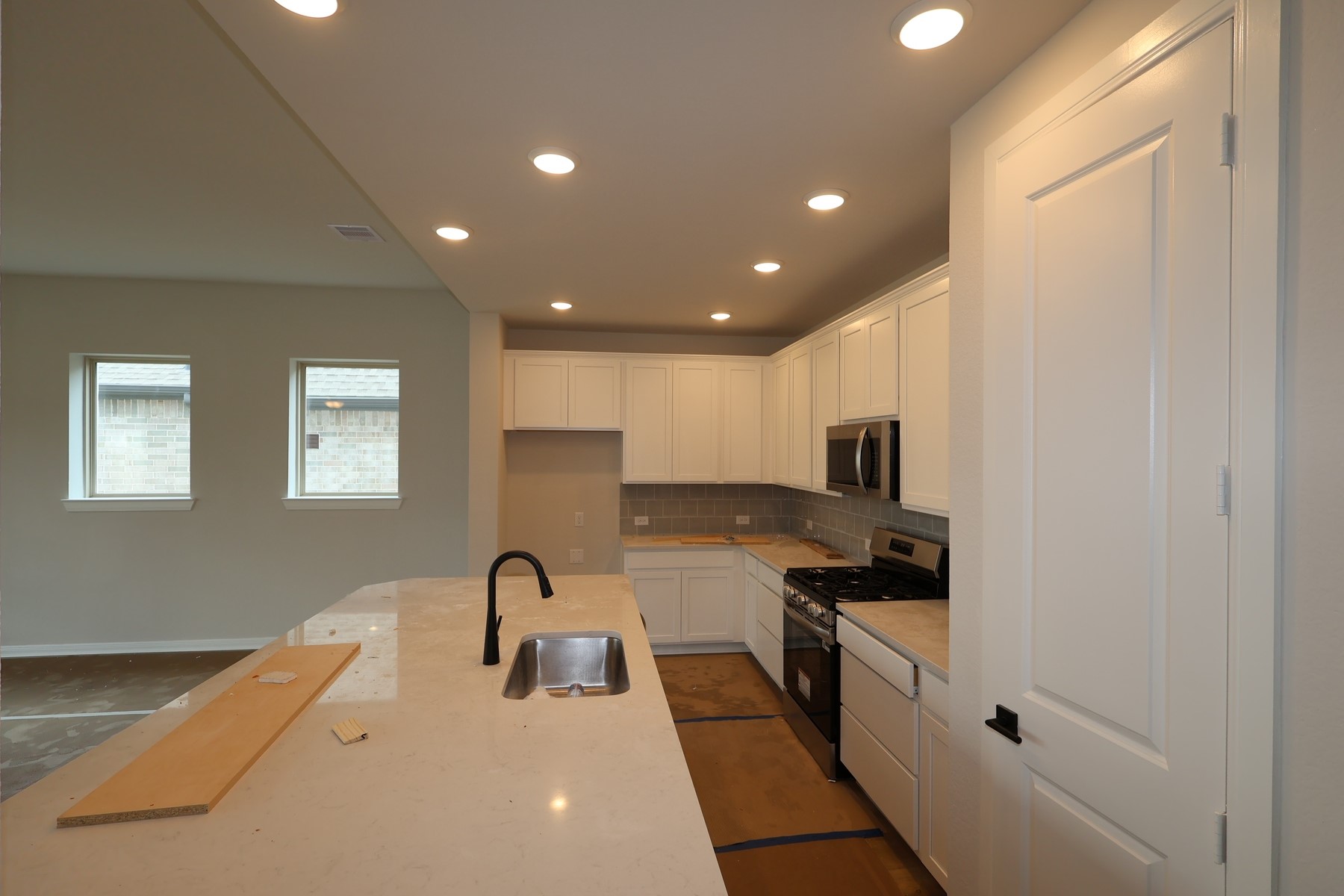 42568 Edmund Rucker Lane Magnolia, TX 77354 - Photo 7 of 18 a kitchen with stainless steel appliances granite countertop a sink and cabinets