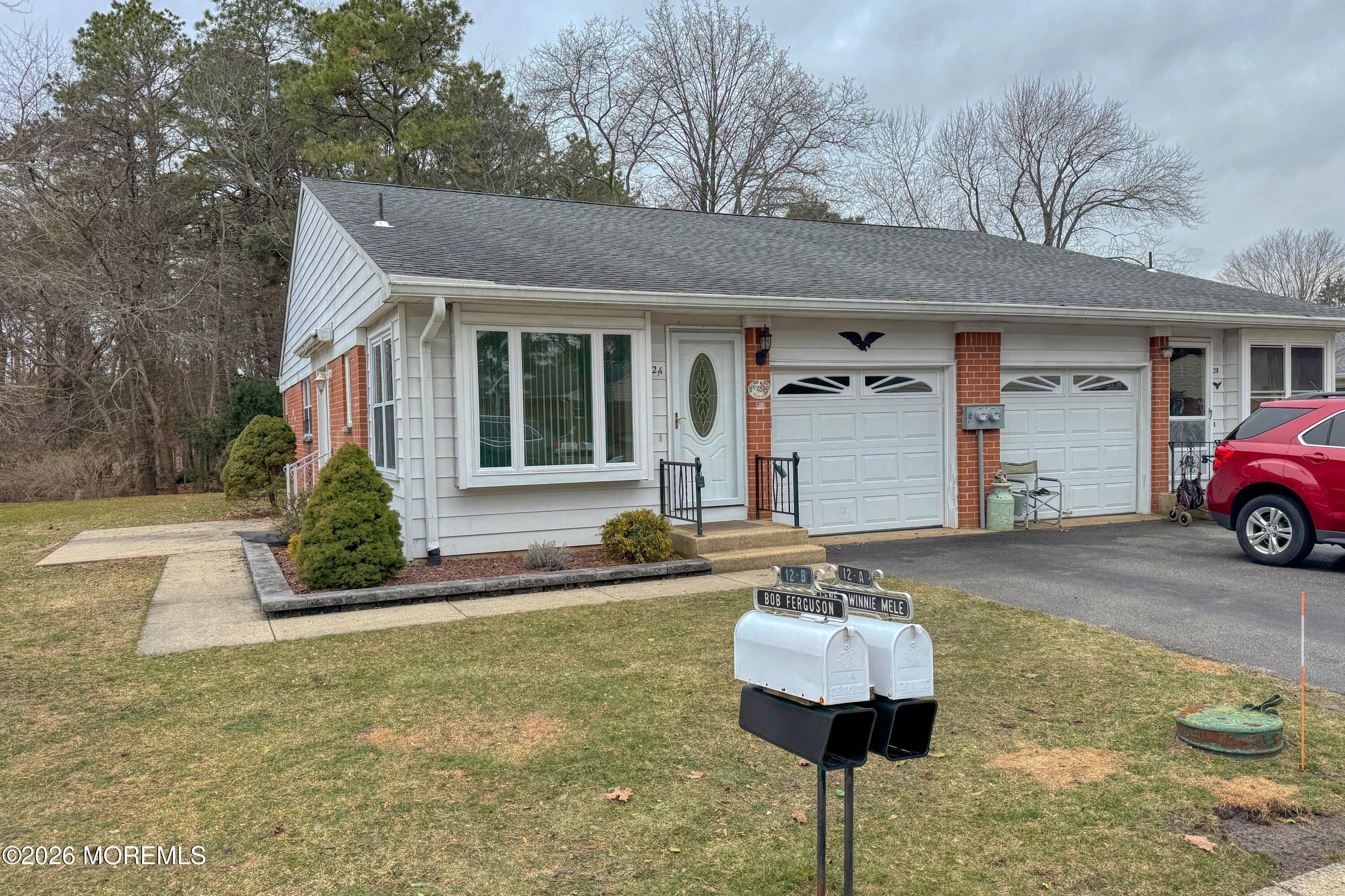 12 Homestead Drive, Unit A Whiting, NJ 08759 - Photo 1 of 18 a front view of a house with yard