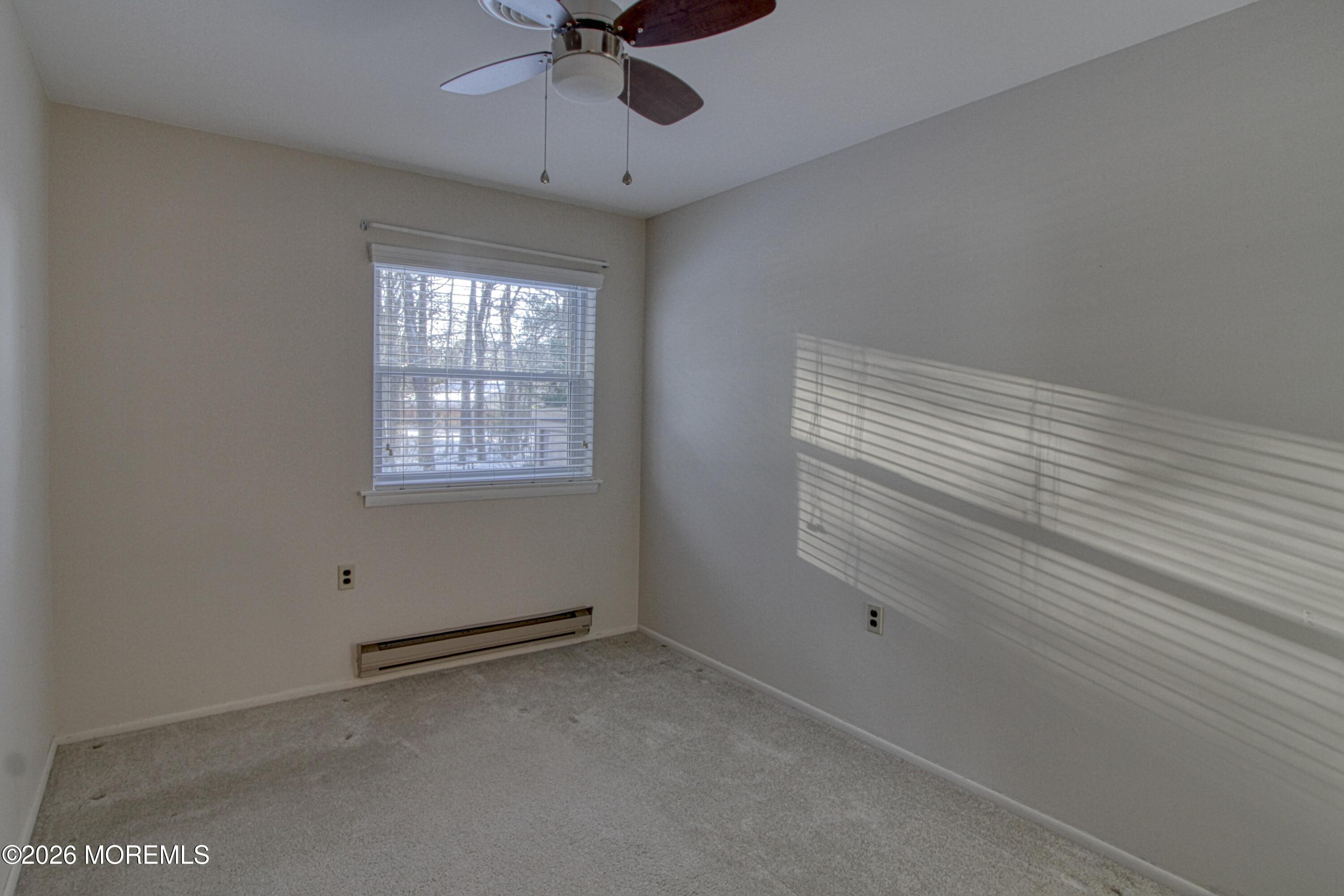 12 Homestead Drive, Unit A Whiting, NJ 08759 - Photo 13 of 18 a view of an empty room with a window