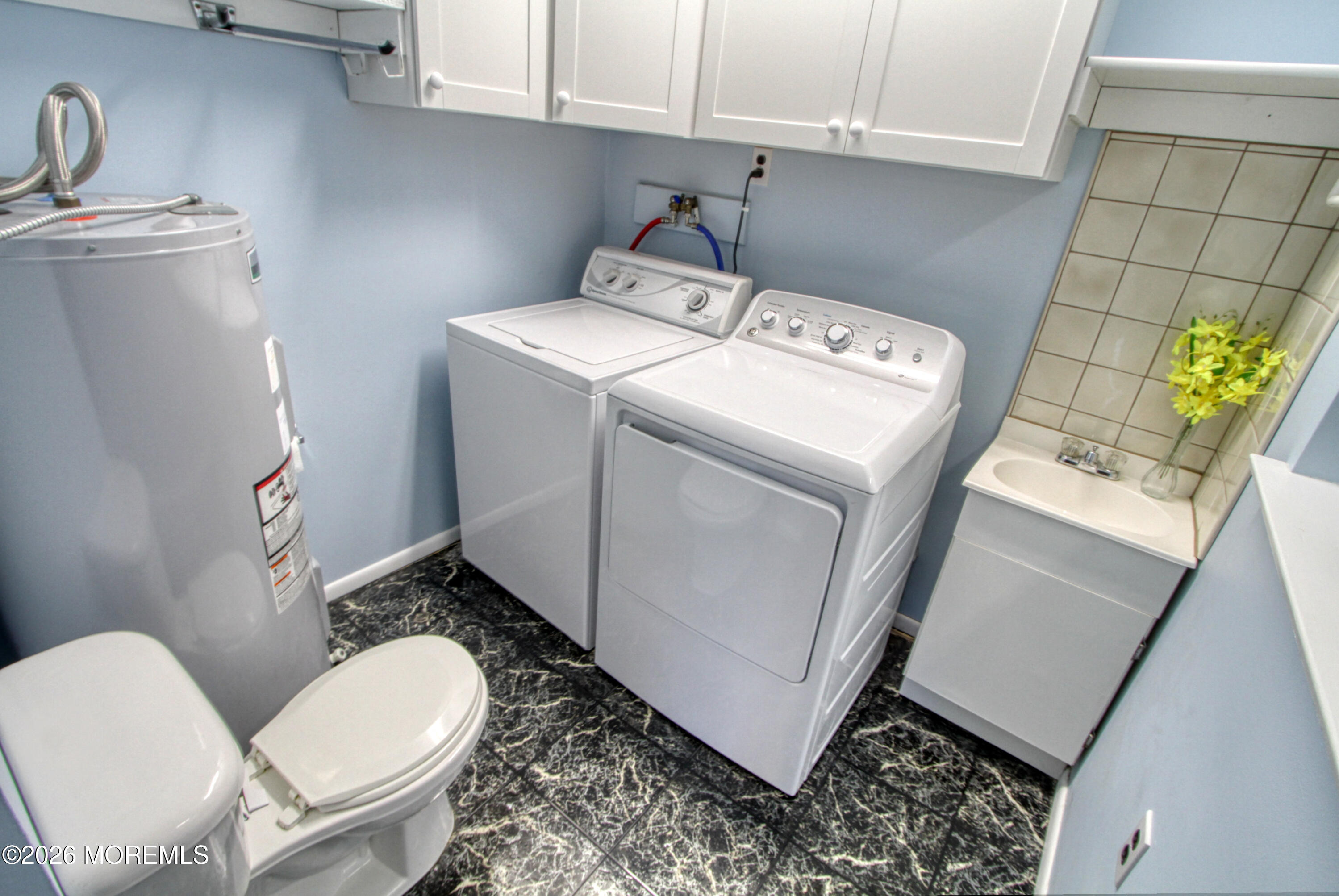 12 Homestead Drive, Unit A Whiting, NJ 08759 - Photo 16 of 18 a utility room with dryer and washer