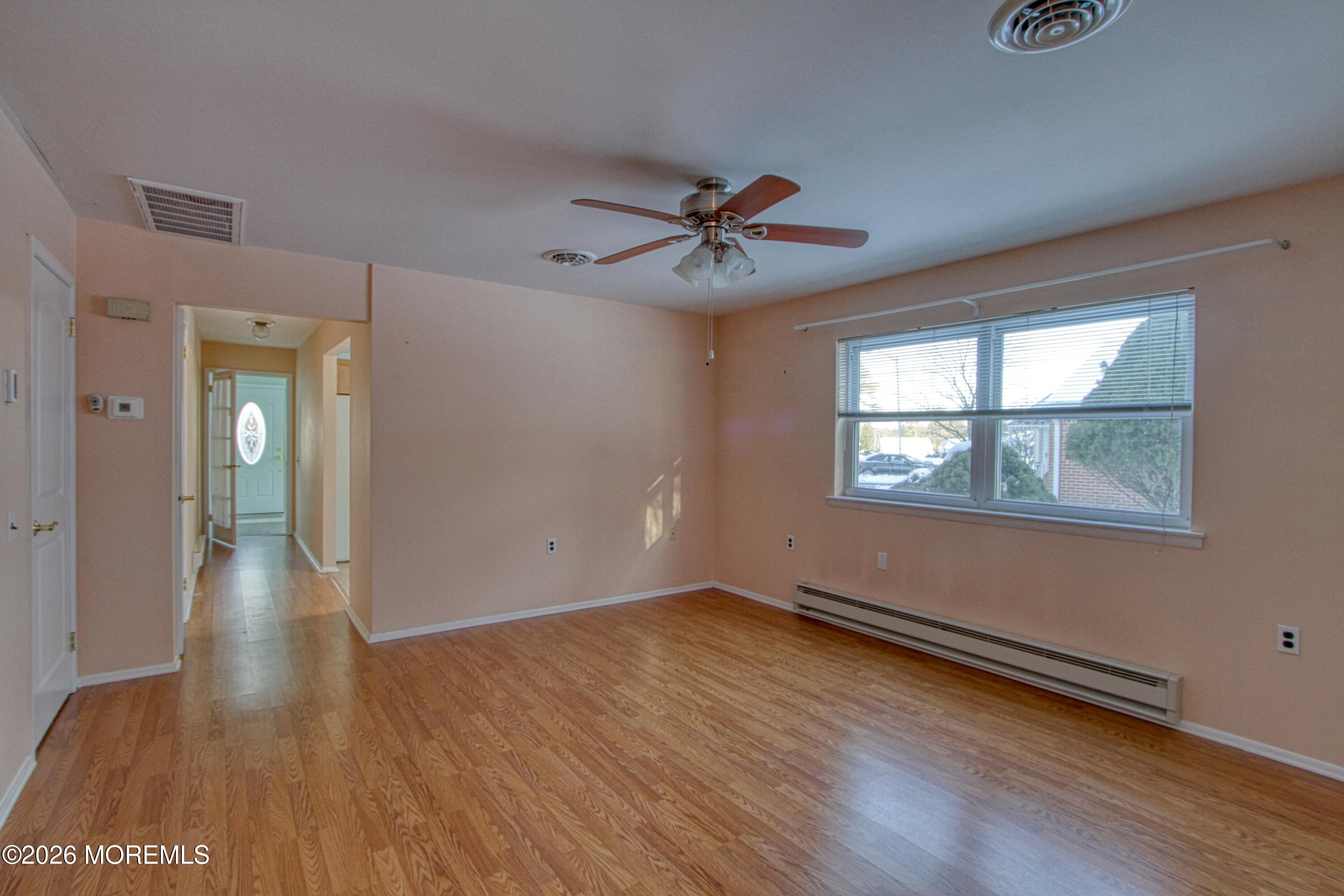 12 Homestead Drive, Unit A Whiting, NJ 08759 - Photo 6 of 18 an empty room with wooden floor and windows