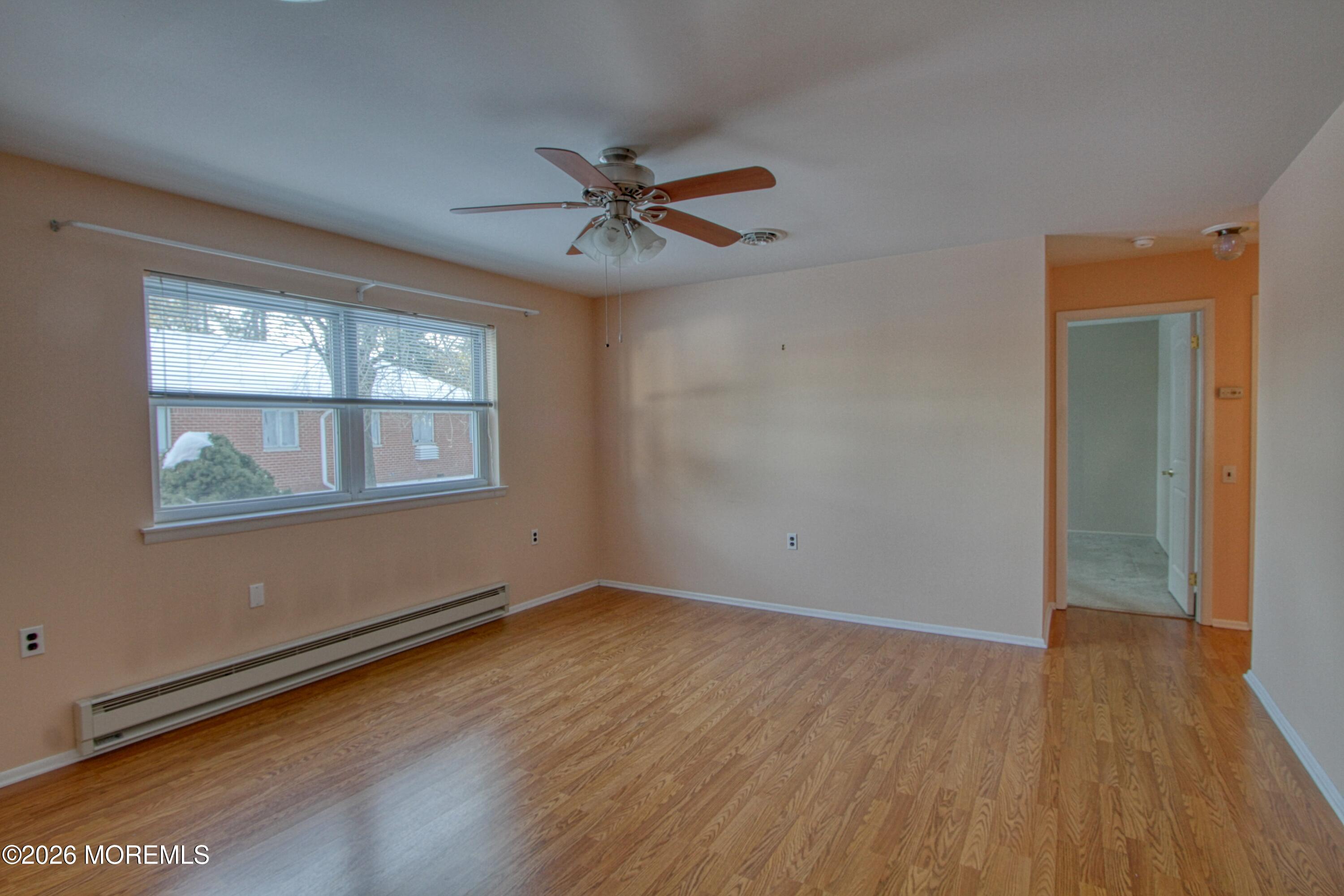 12 Homestead Drive, Unit A Whiting, NJ 08759 - Photo 7 of 18 a view of empty room with wooden floor and fan