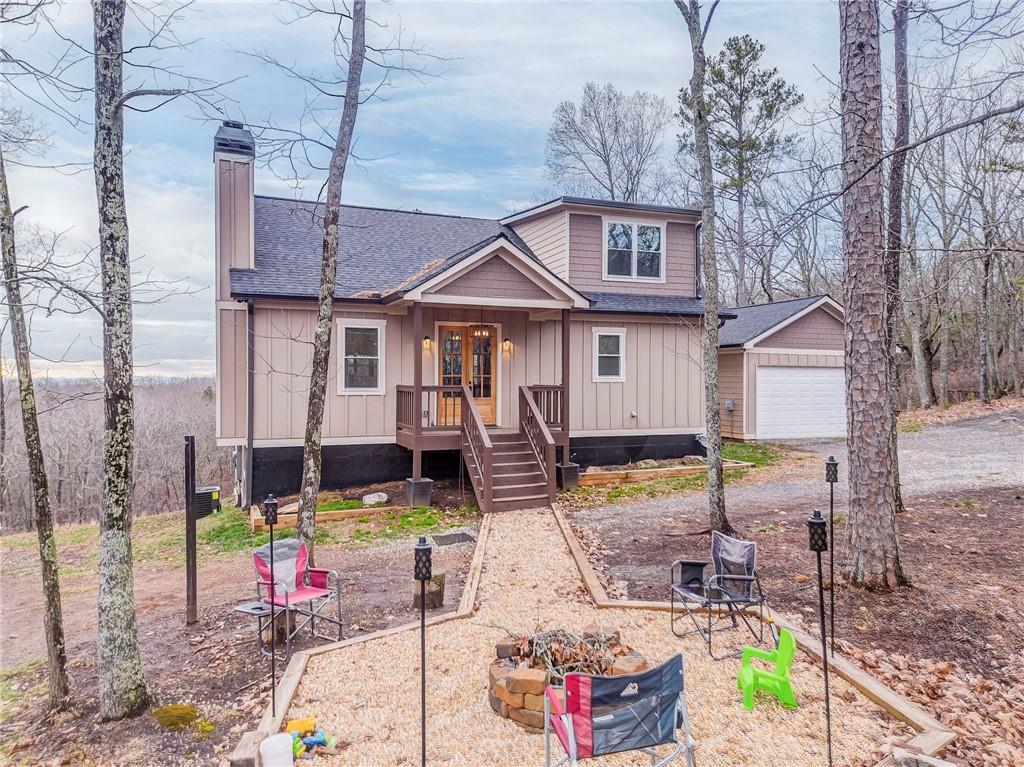 1172 Hunter Drive Ranger, GA 30734 - Photo 11 of 78 a front view of a house with swimming pool and chairs