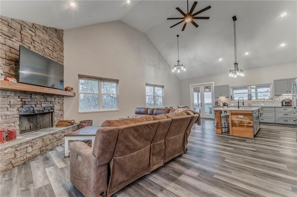 1172 Hunter Drive Ranger, GA 30734 - Photo 15 of 78 a living room with furniture a fireplace and a flat screen tv