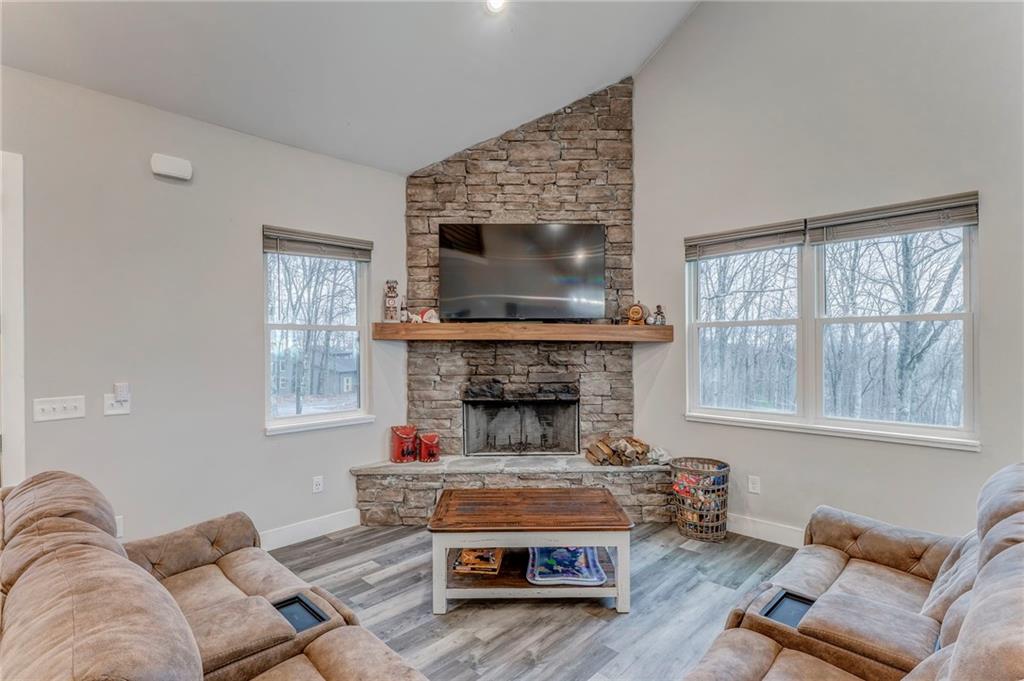 1172 Hunter Drive Ranger, GA 30734 - Photo 16 of 78 a living room with furniture and a fireplace