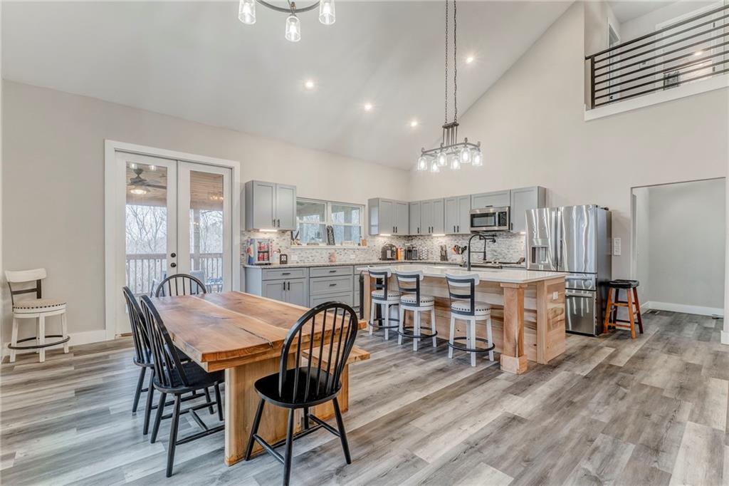 1172 Hunter Drive Ranger, GA 30734 - Photo 30 of 78 a dining room with furniture and wooden floor