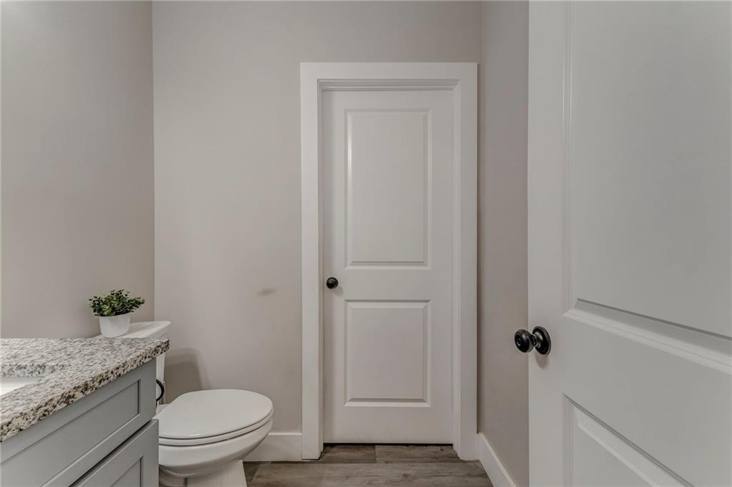 1172 Hunter Drive Ranger, GA 30734 - Photo 32 of 78 a bathroom with a granite countertop toilet and a sink