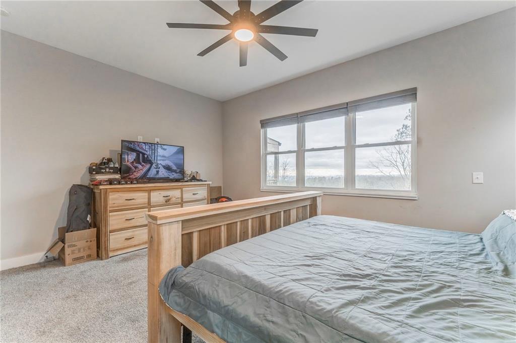 1172 Hunter Drive Ranger, GA 30734 - Photo 37 of 78 a bedroom with a bed and a dresser