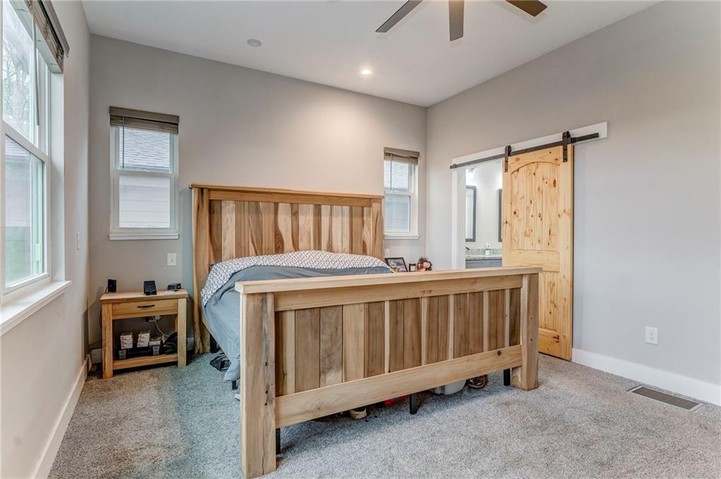 1172 Hunter Drive Ranger, GA 30734 - Photo 39 of 78 a bed sitting in a room next to a window