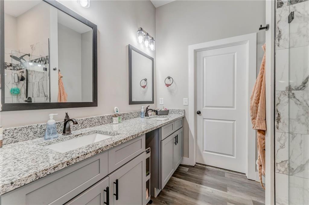 1172 Hunter Drive Ranger, GA 30734 - Photo 42 of 78 a bathroom with a granite countertop sink double and mirror
