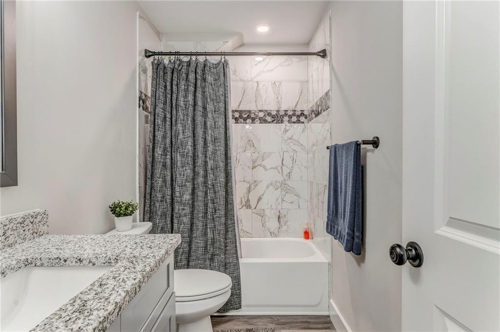 1172 Hunter Drive Ranger, GA 30734 - Photo 50 of 78 a bathroom with a granite countertop sink toilet and shower