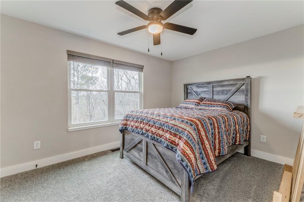 1172 Hunter Drive Ranger, GA 30734 - Photo 51 of 78 a bedroom with a bed and window