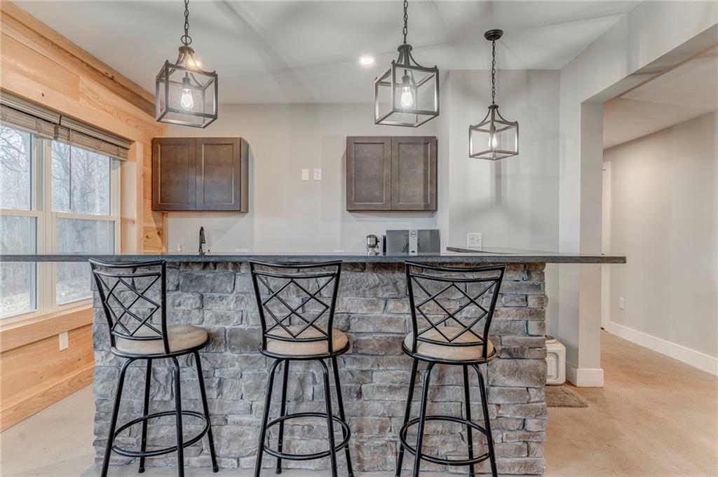 1172 Hunter Drive Ranger, GA 30734 - Photo 56 of 78 a view of a dining room with furniture wooden floor and chandelier