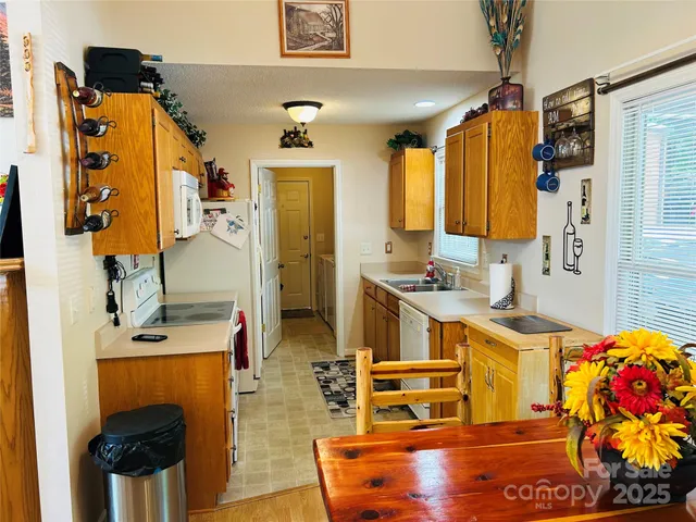 a kitchen with stainless steel appliances a stove a refrigerator and cabinets
