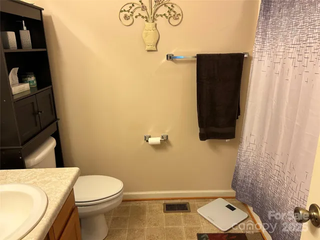 a room with dresser and window